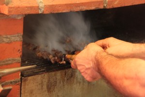 After being skewered, the meat gets lightly roasted in this small oven