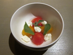 Amuse Bouche of tomatoes and cheese.